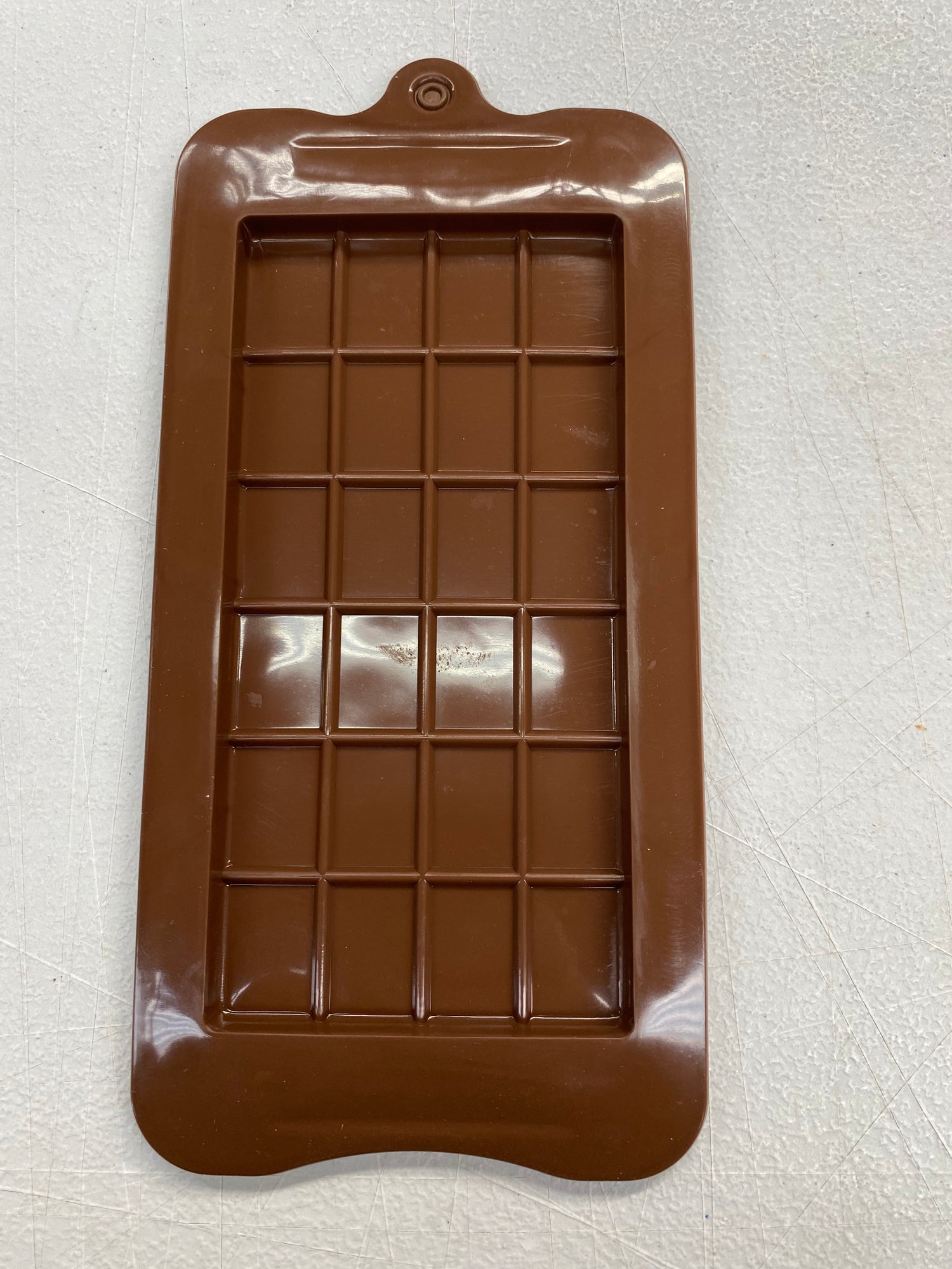 ThinkFoodie 24-piece chocolate bar mold set for baking, with rectangular slabs for making uniform chocolate bars.