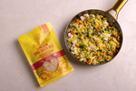 Cooked chicken bone broth rice in a bowl, showcasing the Love My Earth Chicken Bone Broth Rice product.
