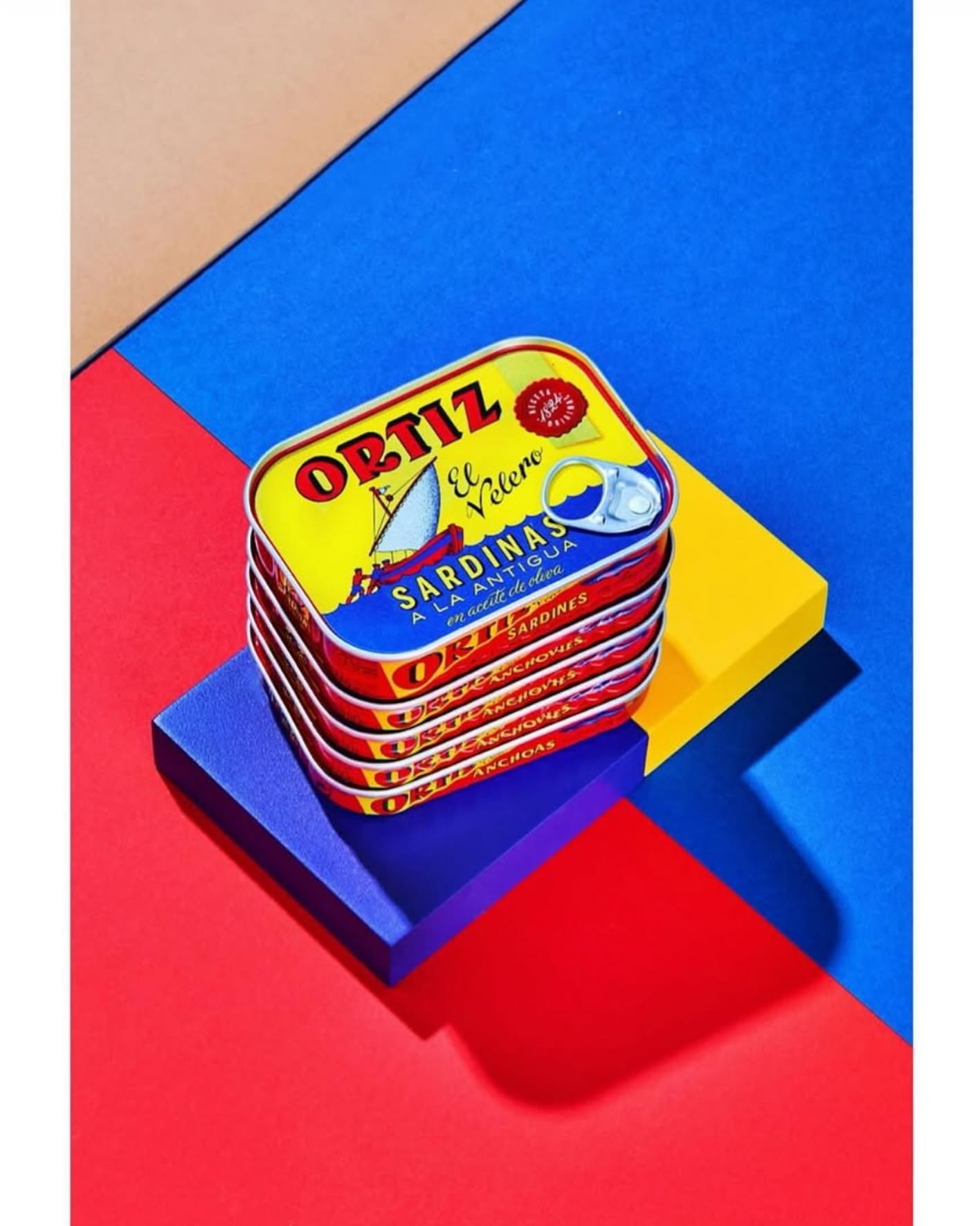 Canned Ortiz sardines in 140g, packed in oil, with visible fish fillets and label on the metal tin.