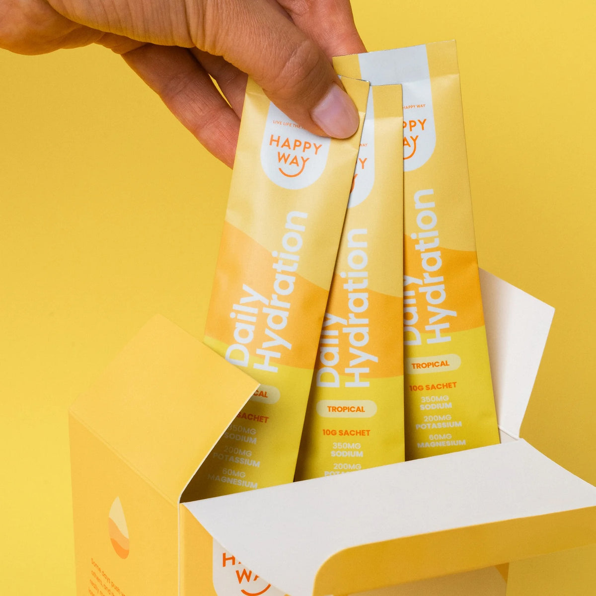 Happy Way Tropical Daily Hydration Sachets in a box, featuring 30 sports and energy drink sachets with tropical flavor.