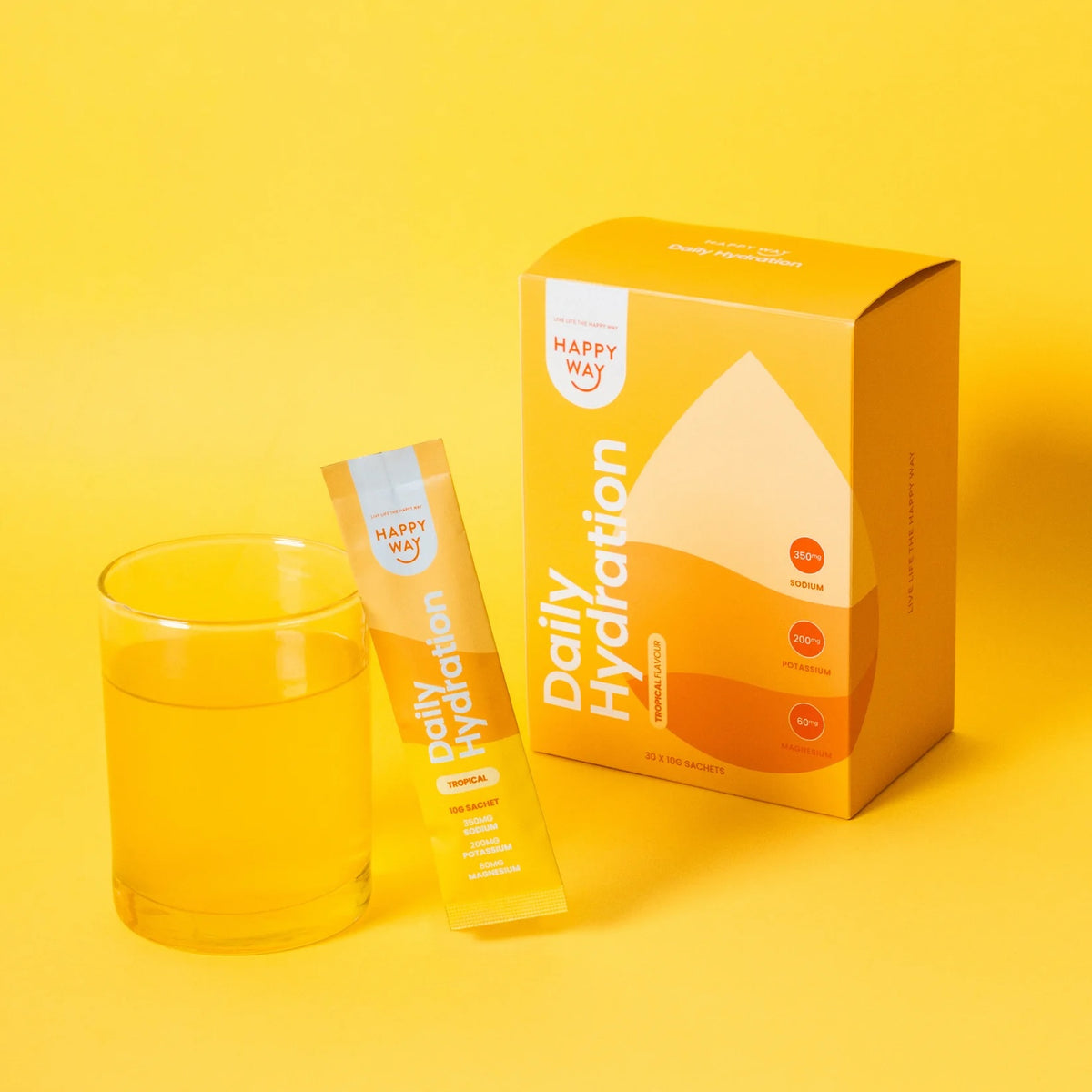 Box of 30 Happy Way Tropical Daily Hydration Sachets for sports and energy drinks, featuring colorful tropical fruit packaging.